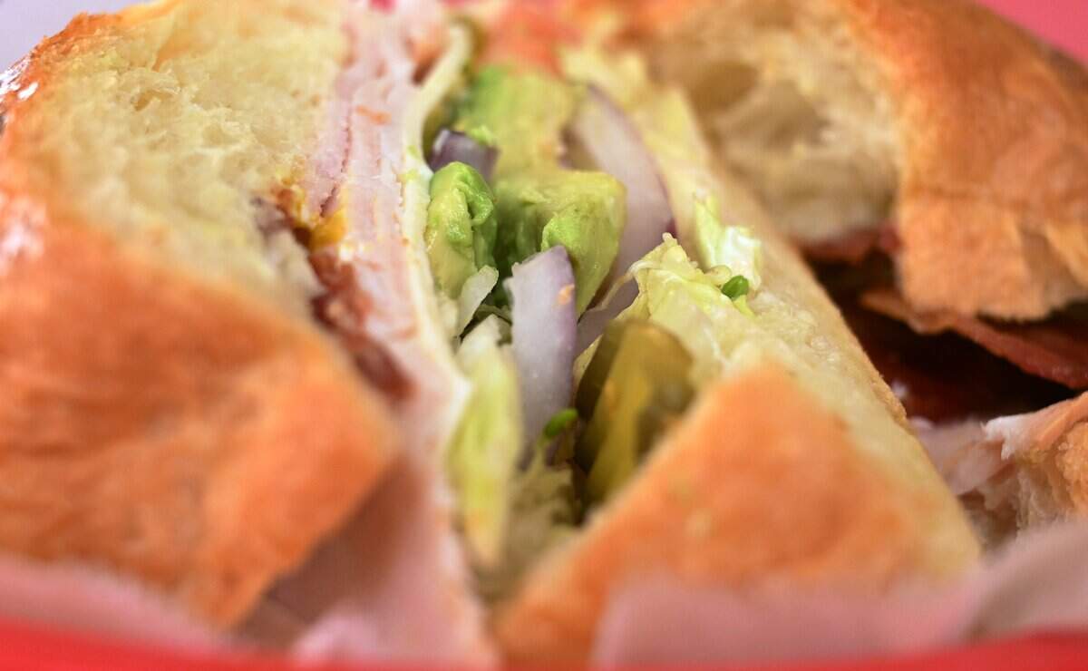 A Turkey, Ham and Bacon croissant sandwich is seen at City Donuts which Tathy Ky and her sister Thida Ky have opened in the former Supreme Donuts location at the corner of Palm and McKinley avenues. Photographed Wednesday, Oct. 22, 2025 in Fresno.