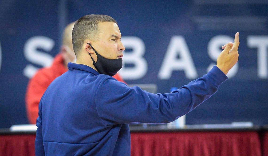 Fresno State head basketball coach Justin Hutson calls over a player during their game against Fresno Pacific at the Save Mart Center in Fresno on Saturday, Dec. 19, 2020.