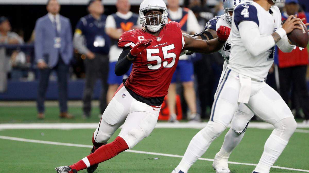 FILE - Arizona Cardinals outside linebacker Chandler Jones rushes Dallas Cowboys quarterback Dak Prescott during the second half of an NFL football game in Arlington, Texas, Jan. 2, 2022. Jones bounced back from an injury-plagued 2020 season to record 10 1/2 sacks in 2021 for his seventh double-digit sack season. Only 12 players have had more seasons with at least 10 sacks and Jones’ 107 1/2 for his career lead the NFL since he made his debut in 2012.