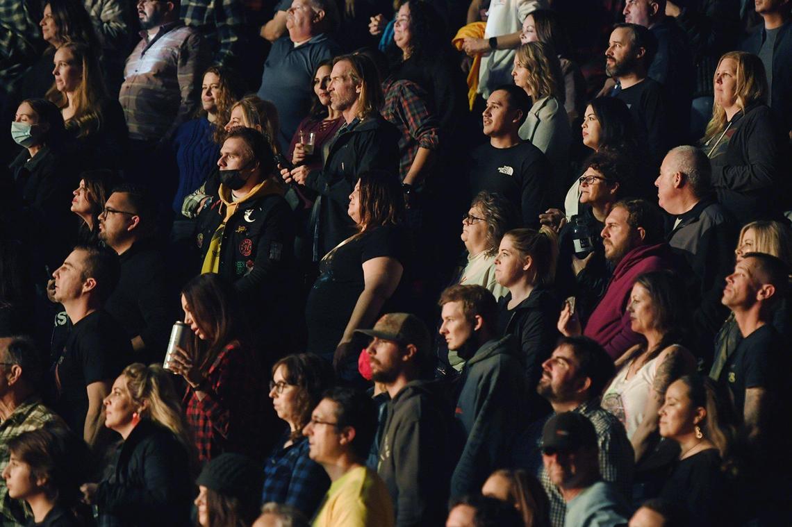 Few masks are seen as Foo Fighters perform at Save Mart Center Thursday, Dec. 9, 2021 in Fresno. Health screenings with proof of vaccination or negative test results were required before entry to the venue.