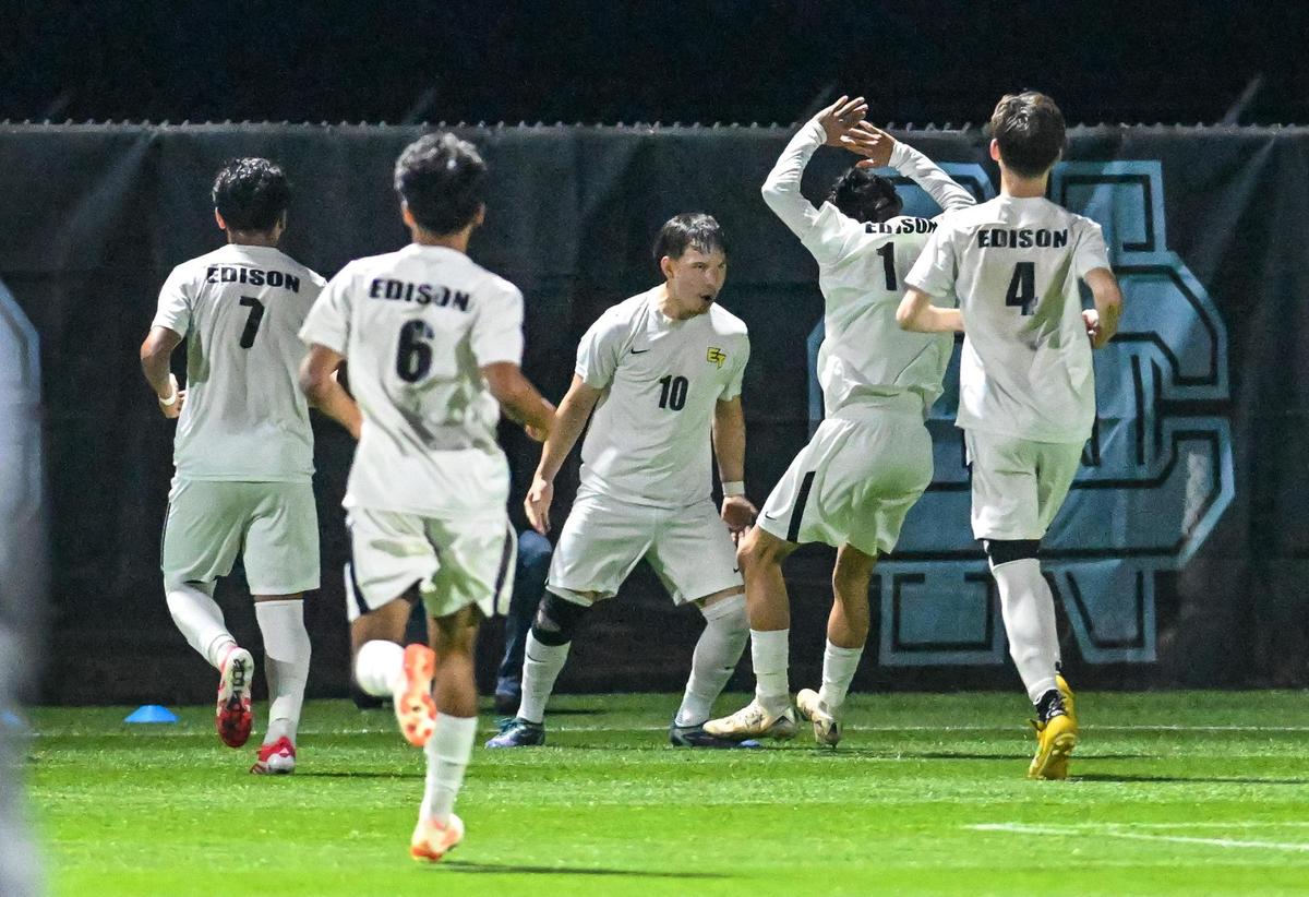 Edison boys soccer players congratulate teammate Anthony Verduzco after he scored a goal on a penalty kick in the first half of their Division 1 soccer final against Clovis North on Thursday, Feb. 27, 2025.