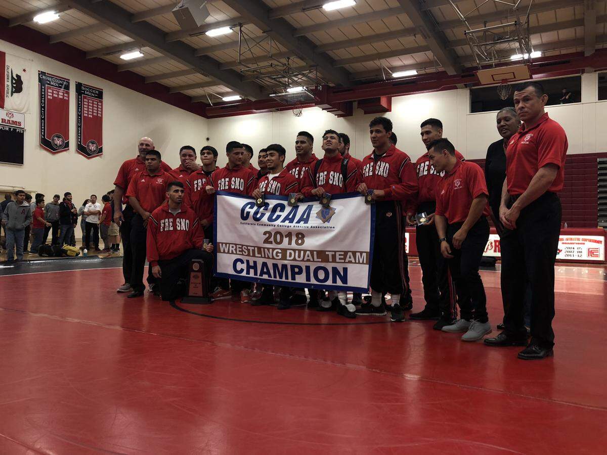The Fresno City College wrestling team poses for a photo after a state dual championship over Cerritos. The Rams will compete at the state championships in two weeks.