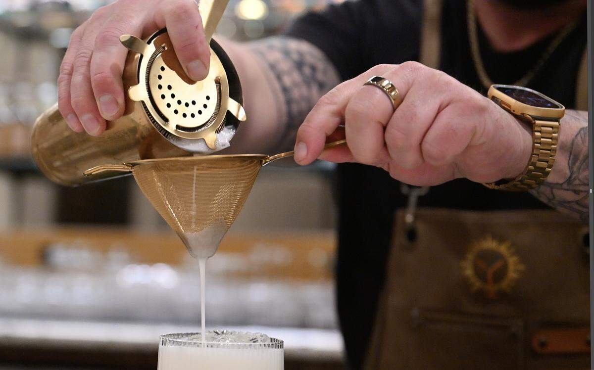 Dustin LLanes, general manager at The Golden Hour Cocktail Lounge, creates a cocktail Wednesday, Feb. 4, 2026 in Fresno.