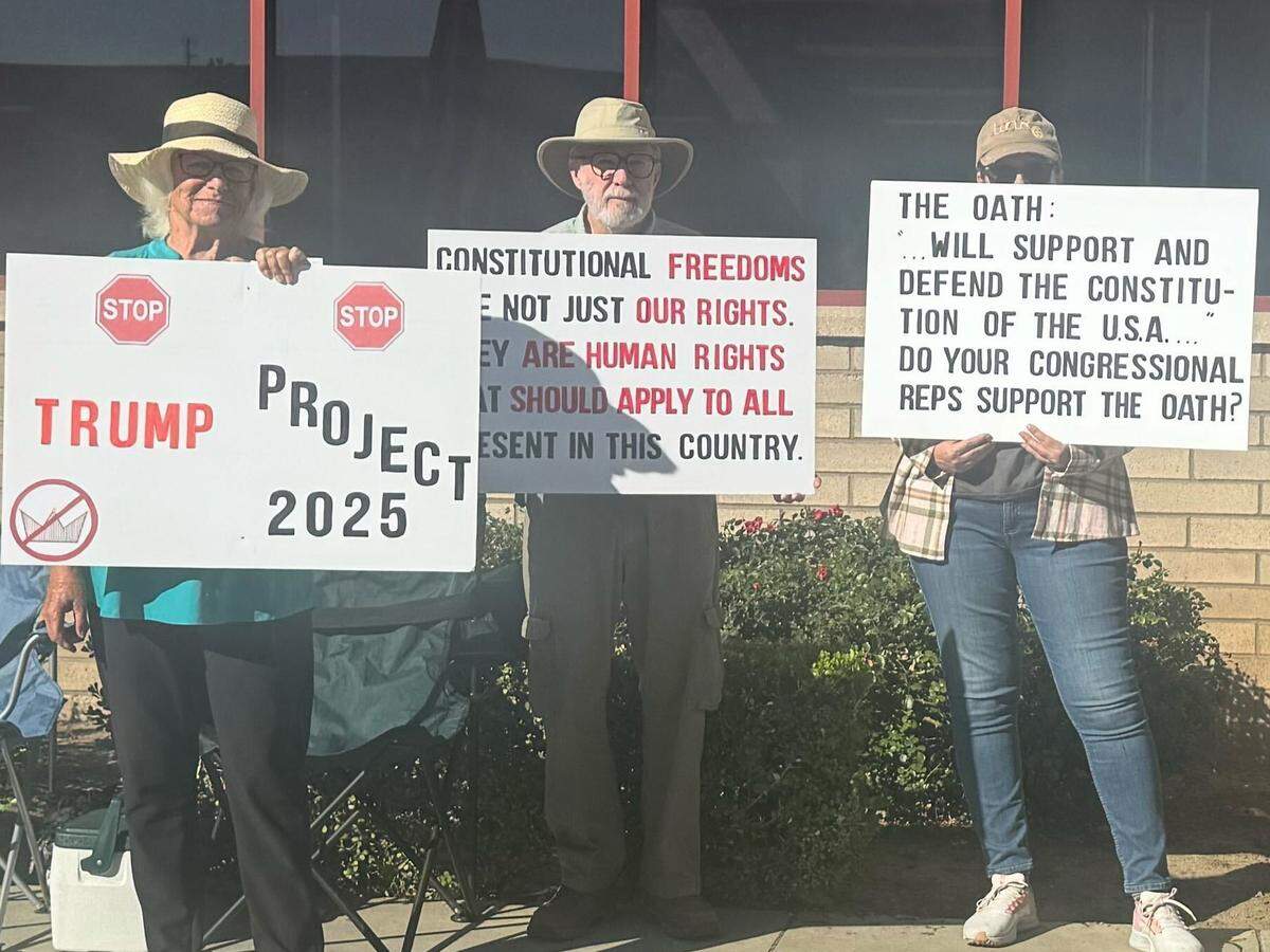 Local residents protest against ICE activity outside the agency’s Fresno office.