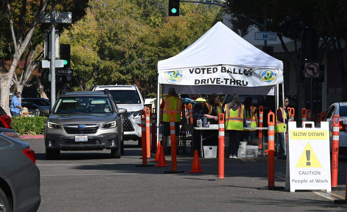 A drive-through service is seen outside the Fresno County Elections office on Kern Street as voters hand off their ballots Tuesday, Nov. 4, 2025 in Fresno.