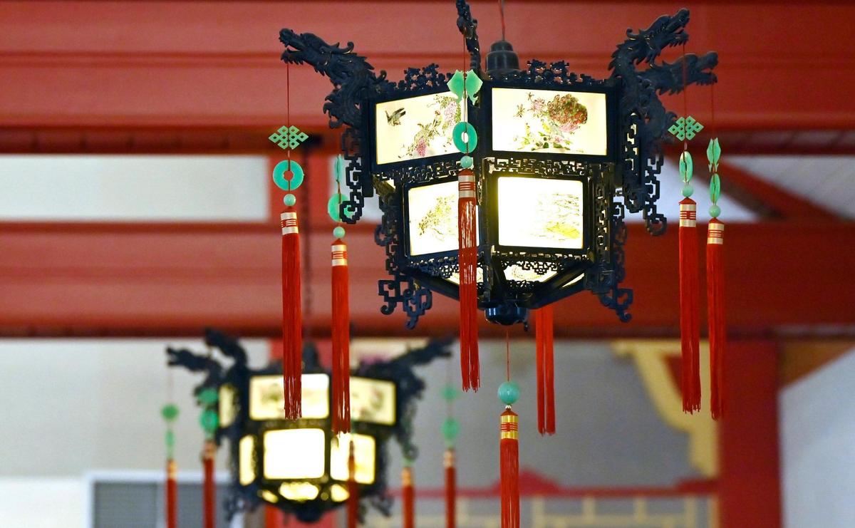 Chinese lanterns and red beams inside St. Genevieve Catholic Church reflect its Chinese design, photographed Sunday, Oct. 27, 2024, in Fresno.