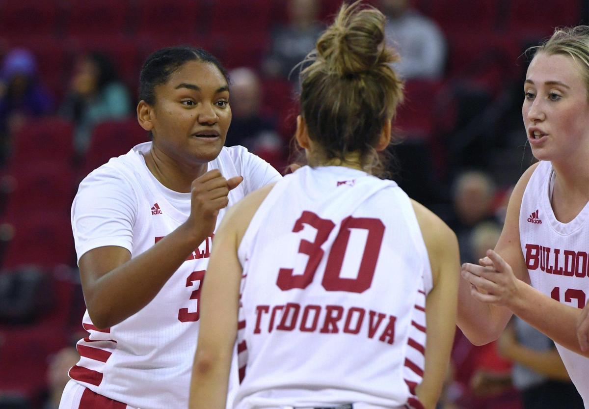 Fresno State’s Amaya West, left, with Yanina Todorova, center, and Amiee Book to the right in the game against Fresno Pacific Monday, Nov. 7, 2022 in Fresno.