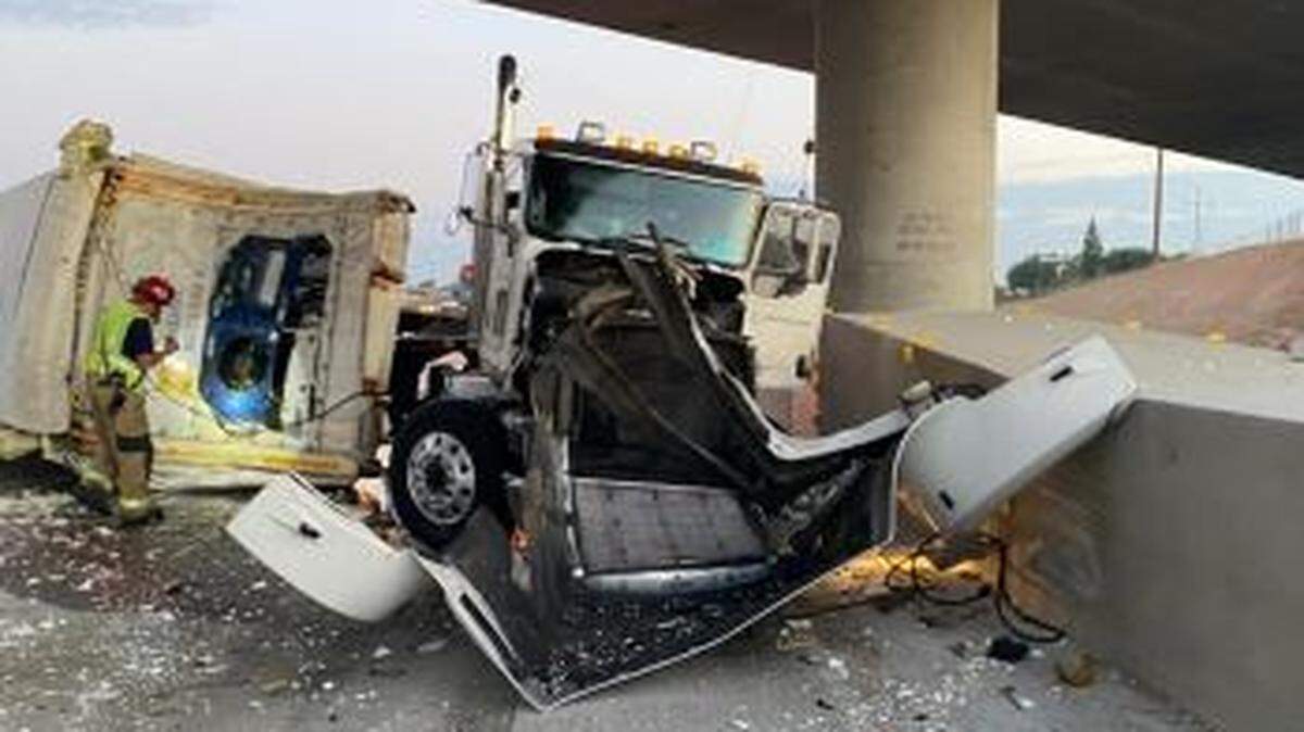 An overturned big rig and trailer blocked southbound traffic on Highway 99 at Bethel Avenue on Tuesday morning, July 27, 2021.