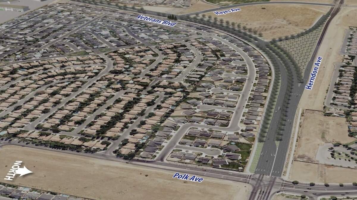 A screenshot of a city of Fresno video about the Veterans Boulevard Corridor Project shows where Veterans Boulevard merges into Herndon Avenue near Polk Avenue. The new road pattern makes eastbound Herndon drivers turn left onto Veterans before continuing to the old Herndon alignment. The design also leaves a landlocked 2.6-acre triangle covered in trees in this depiction.