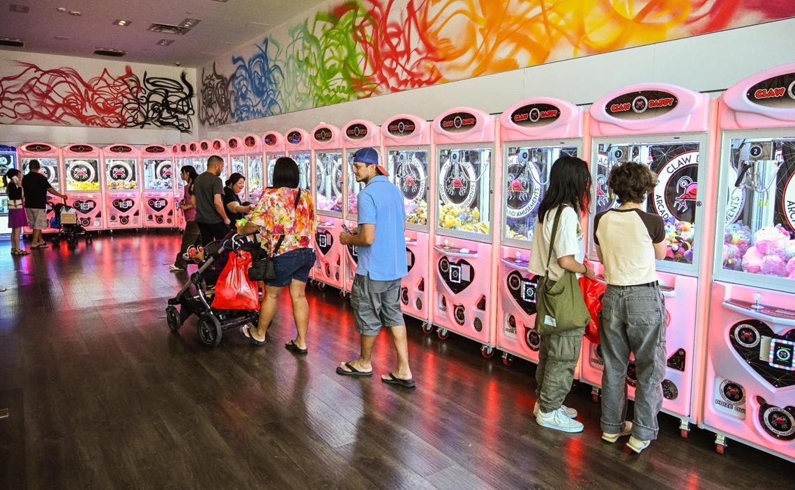 Rows of claw games with various prizes await visitors at Claw Daddy arcade at Fashion Fair in Fresno on Tuesday, Aug. 22, 2023.