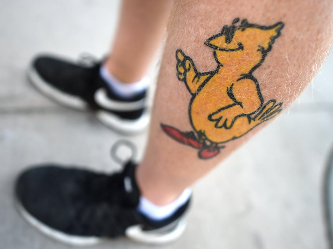 Passion for his Chicken Shack restaurant in seen in a tattoo of "Fred" on Damon Miller's leg.