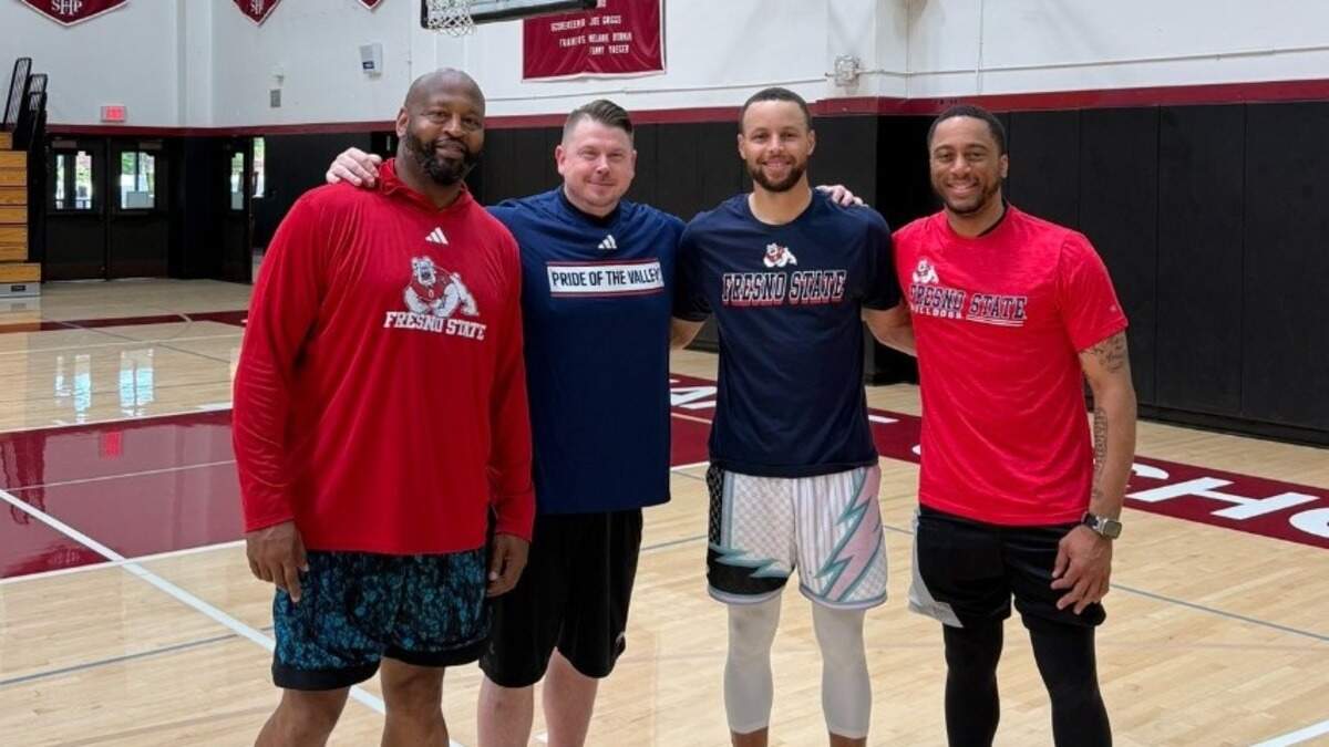 Fresno State assistant women’s basketball coach Ramaundo Vaughn, far left, pictured with Golden State Warriors superstar Steph Curry.