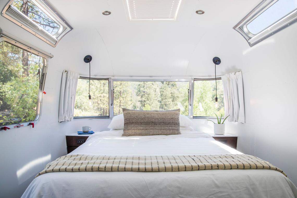 The inside of an Airstream trailer available for rent at AutoCamp Yosemite in Midpines, near Yosemite National Park.