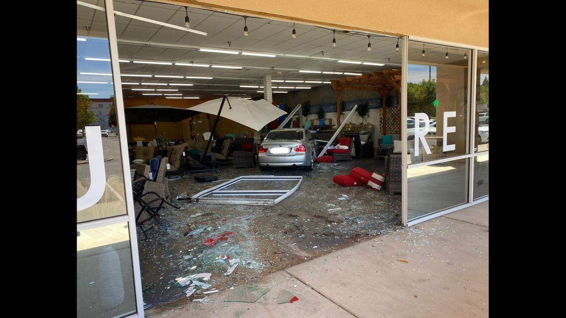 A man drove his BMW through the glass doors of a furniture store in Clovis on Friday, police said.&nbsp;