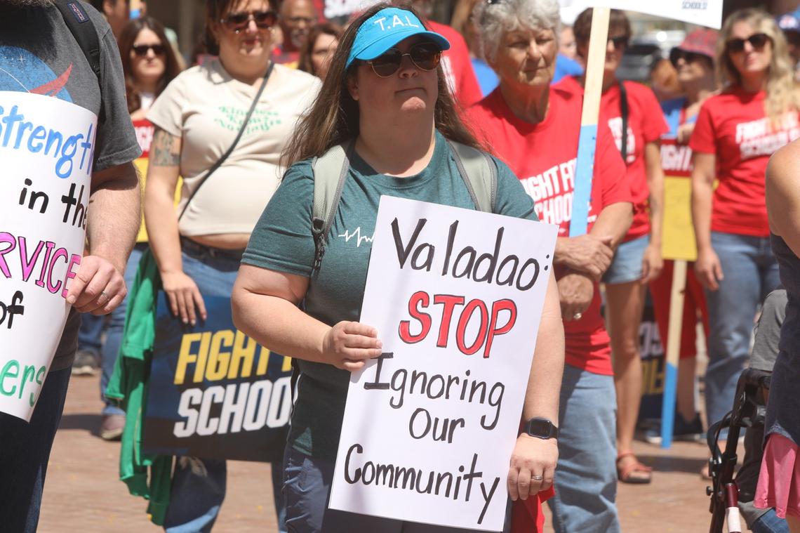 Central Valley educators, families, students and supporters demand U.S. Rep. David Valadao to defend funding for valley schools and urge the Republican congressman to oppose federal cuts to public education on May 17 in Hanford CA.