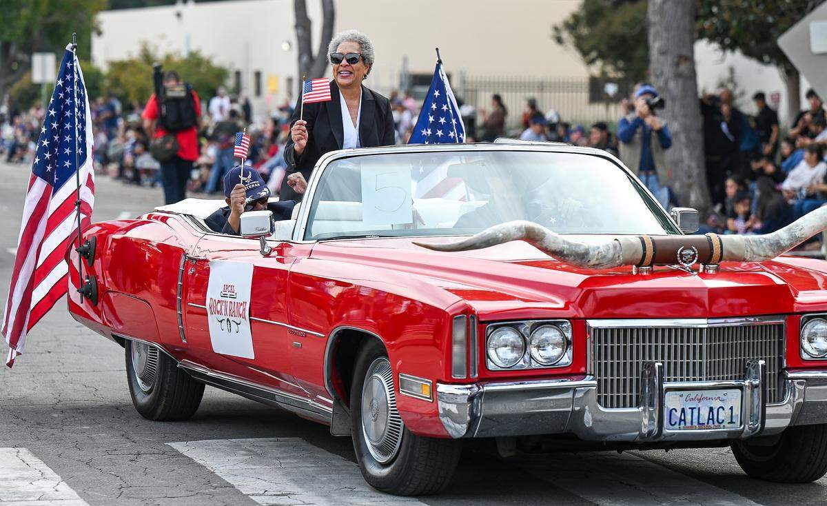 Fresno County Superior Court Judge Glenda Allen-Hill, grand marshal for the Central Valley Veterans Day Parade, waves from a vehicle as the parade gets started near Fresno City Hall in downtown Fresno on Tuesday, Nov. 11, 2025. 