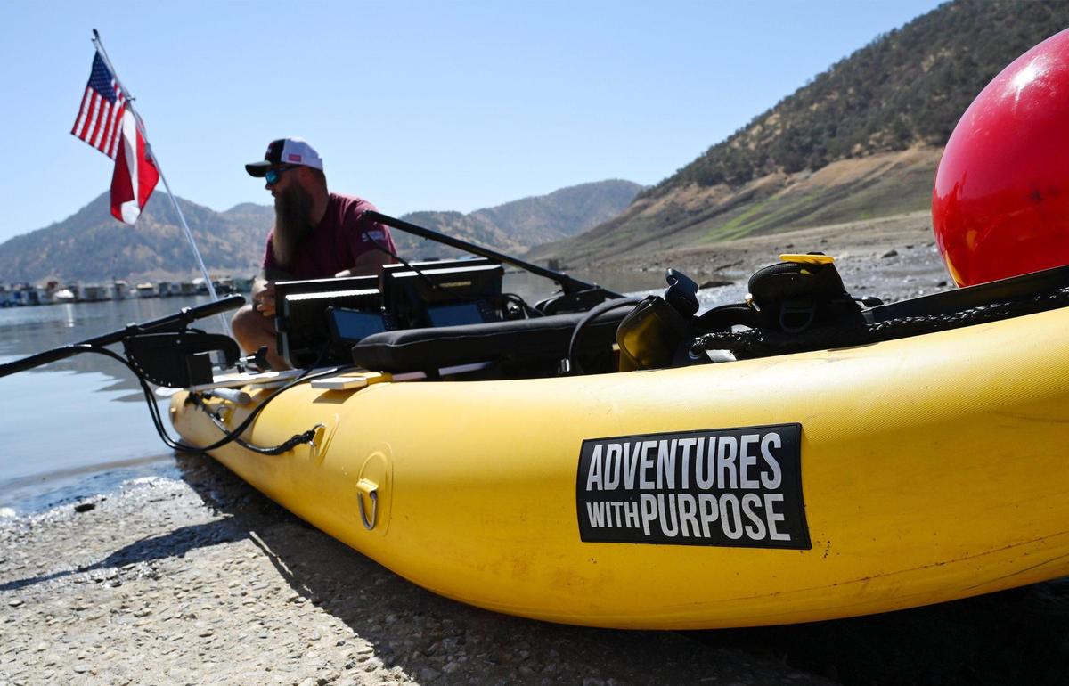 Adventures With Purpose team leader Doug Bishop is seen in one of two inflatable watercraft being used in the search for Jolissa Fuentes at Pine Flat Lake’s Deer Creek marina Friday morning, Aug. 26, 2022 in Fresno. The team search Avocado Lake on Thursday.