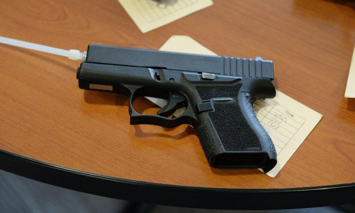 A confiscated “ghost” gun is laid out as evidence during a news conference to announce the arrest of 120 local gang members effort led by the U.S. Marshals Service at the Robert E. Coyle United States Courthouse in downtown Fresno on Tuesday, Oct. 8, 2019.