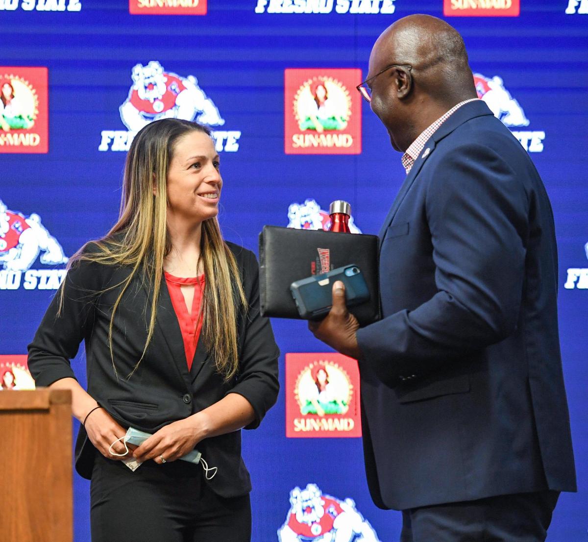 Fresno State athletics director Terry Tumey has a word with Stacy May-Johnson after she was introduced as the Bulldogs’ new softball coach, in the Josephine Theater in the Duncan Building on Tuesday, July 6, 2021.