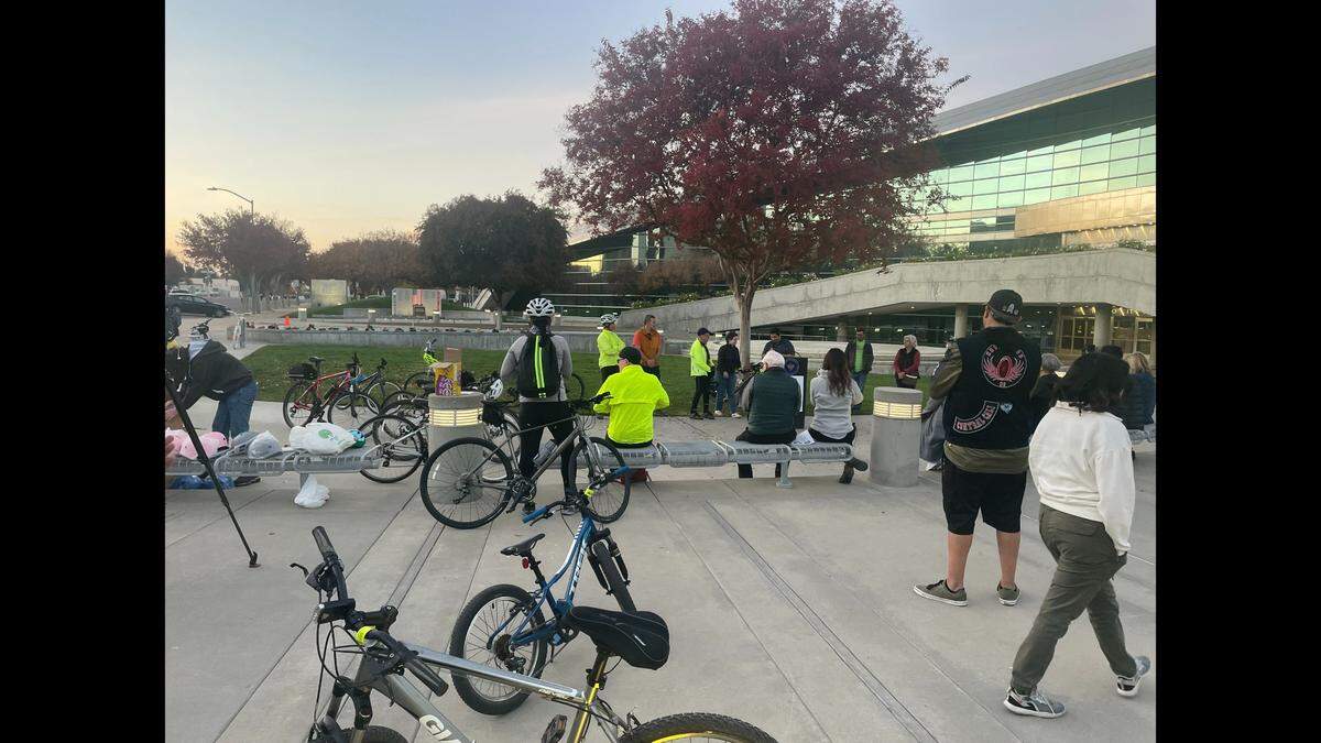 Bicyclists and pedestrian gather at Fresno City Hall to advocate for safer roadways before a vigil and walk to the Fresno Water Tower.