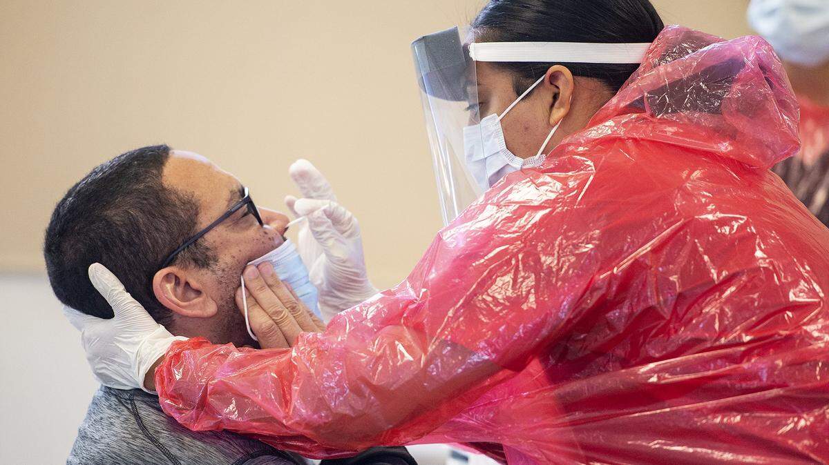 Darwin Duncan, 54, of Atwater, undergoes a test at a COVID-19 testing site located at the Merced County Fairgrounds in Merced, Calif., on Monday, May 4, 2020.