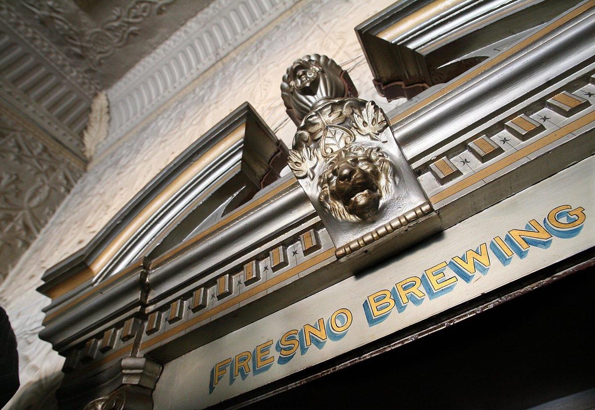 The Fresno Brewing Company’s walk-in safe from 1907, guarded by a gilded, heraldic-style lion in the office.
