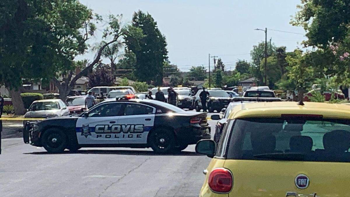 Clovis police investigate a shooting scene on Rialto Avenue near Willow Avenue on May 27, 2022.