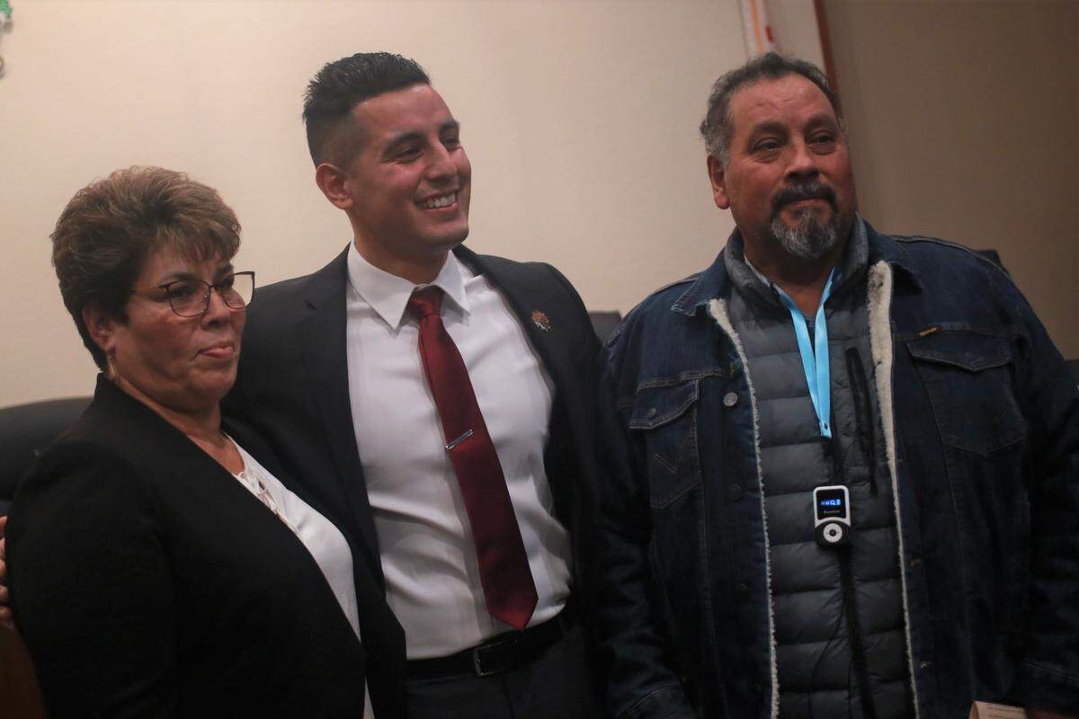 Visalia’s newly elected city council member Emmanuel Hernández Soto (center) with his parents Antonia Soto de Hernández and Manuel Hernández after taking oath Wednesday night (Dec. 7) during a special meeting.