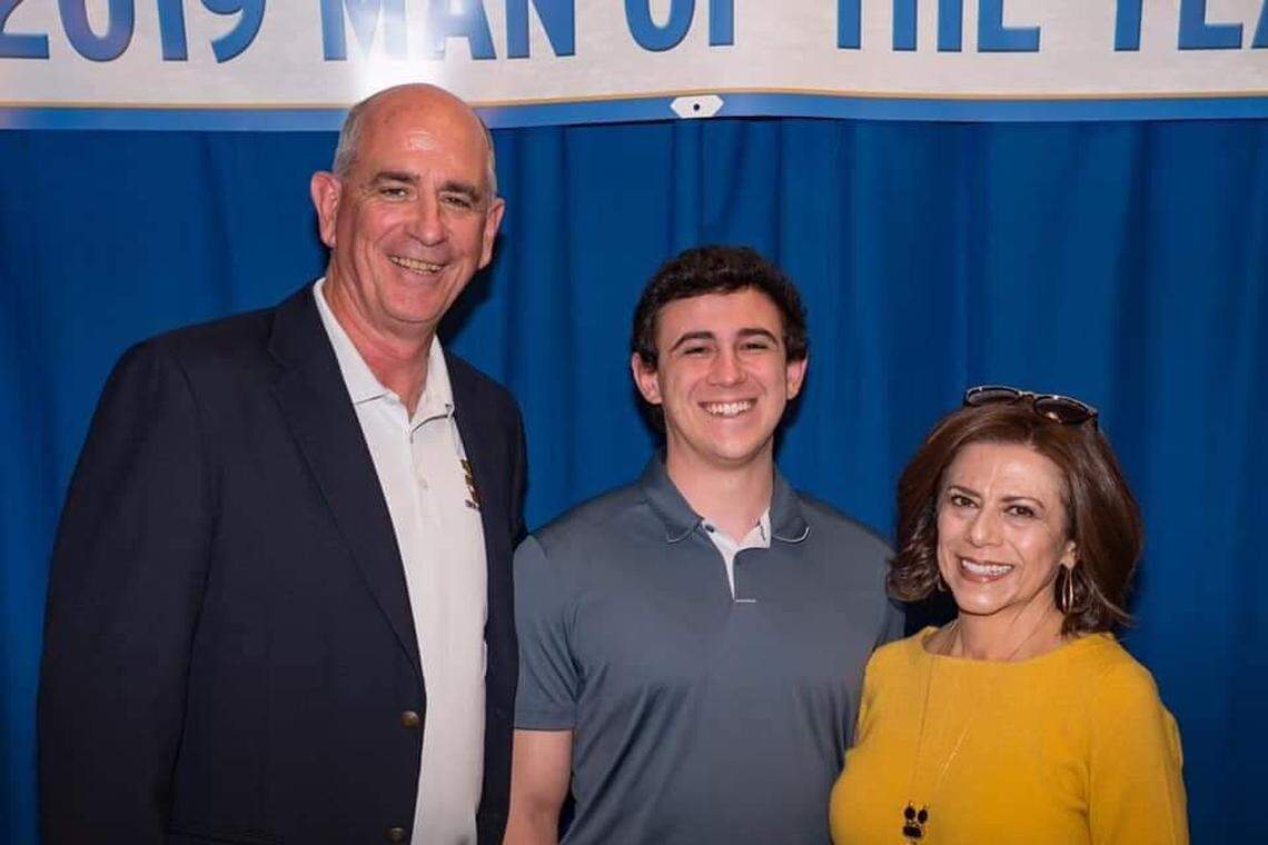 Tim Liles with his son Zackary and wife Valerie after receiving the 2019 man of the year award for southeast Fresno from City Councilmember Luis Chavez, one of Liles’ former students.