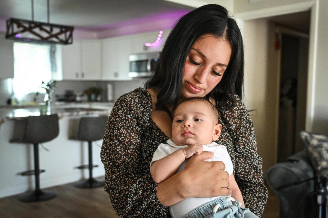 Karla Alvarez holds her baby son, Maximus Gonzalo Carrasco, the son of fallen Selma police officer Gonzalo Carrasco Jr, at her home in Dinuba on Tuesday, May 9, 2023. Baby Max was born just about a month after his father was murdered in the line of duty last January 31, 2023.