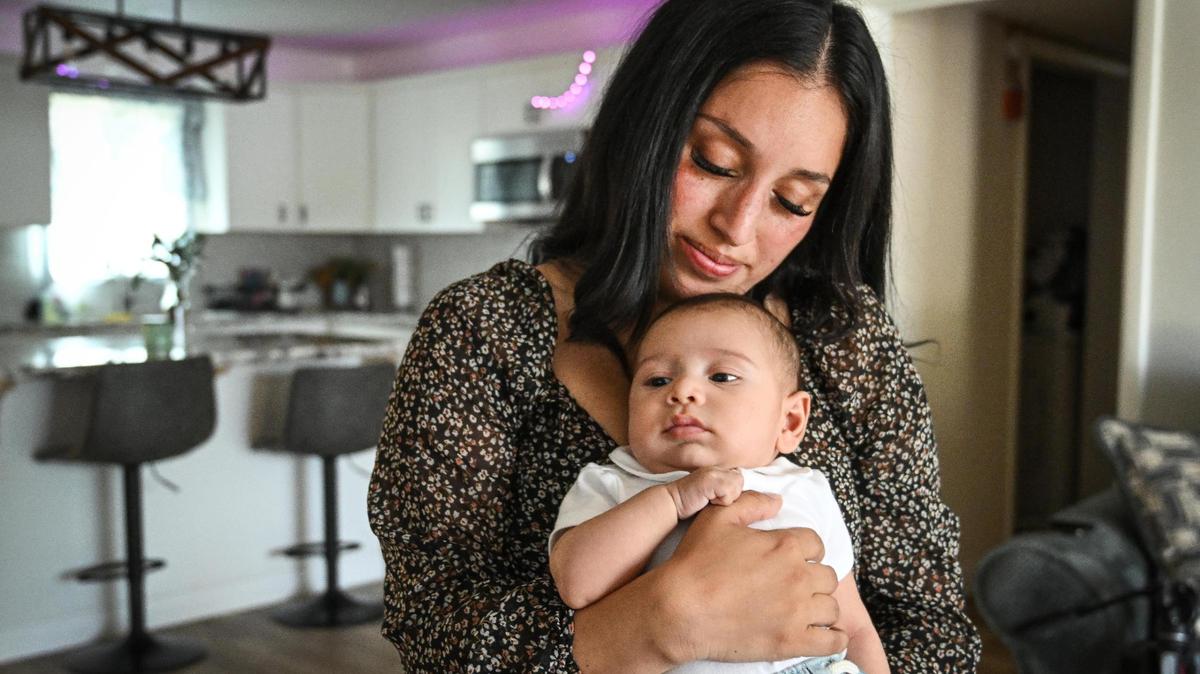 Karla Alvarez holds her baby son, Maximus Gonzalo Carrasco, the son of fallen Selma police officer Gonzalo Carrasco Jr, at her home in Dinuba on Tuesday, May 9, 2023. Baby Max was born just about a month after his father was murdered in the line of duty last January 31, 2023.