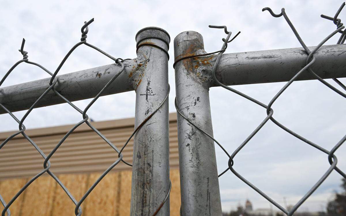 Chain link fencing surrounds the Wendy's and adjacent KFC on C Street just south of Fresno Street. Photographed Tuesday, Feb. 10, 2026 in Fresno.