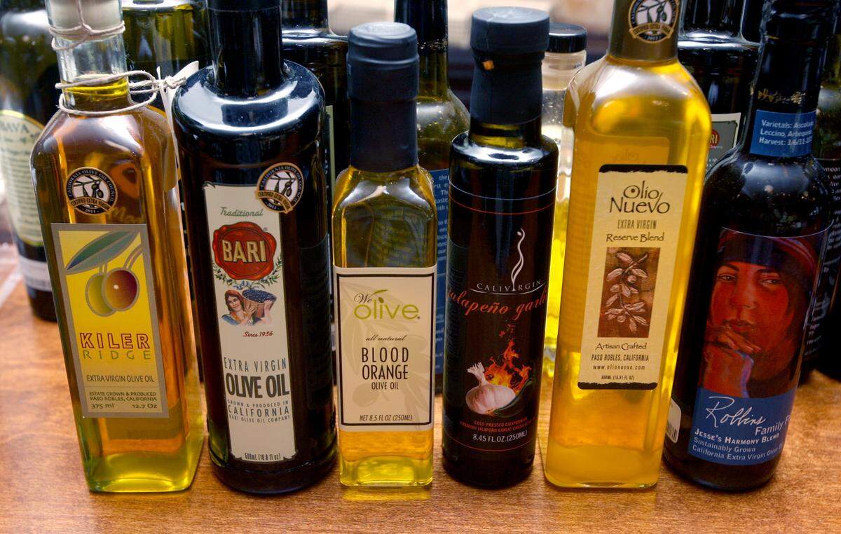 MARK CROSSE/THE FRESNO BEE We Olive is a store specializing in California olive oil and olive oil related items. These are just a few of the bottles of California olive oil.