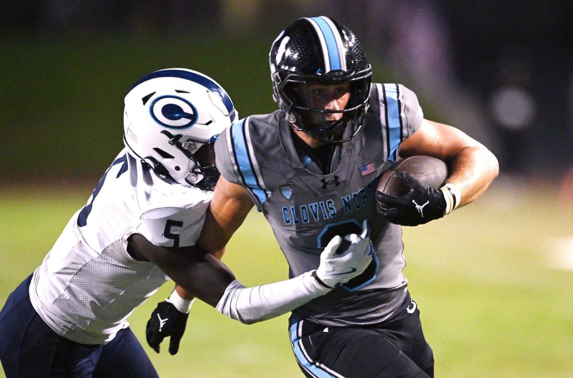 Clovis North’s McKay Madsen, right, runs around CVC’s Ryan Lewis, left, in a game Friday, Sept. 13, 2024 in Clovis.