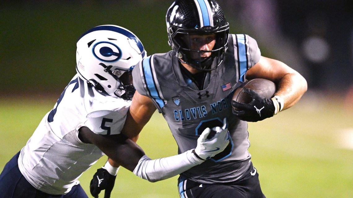 Clovis North’s McKay Madsen, right, runs around CVC’s Ryan Lewis, left, in a game Friday, Sept. 13, 2024 in Clovis.