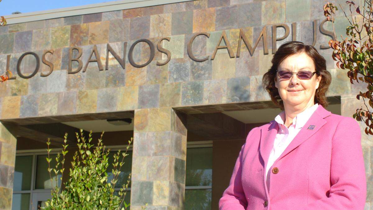 Dr. Brenda Latham, the sixth dean of the Los Banos Campus of Merced College, who served during the campus’s fourth decade, stands proudly in front of the current facility on Highway 152.