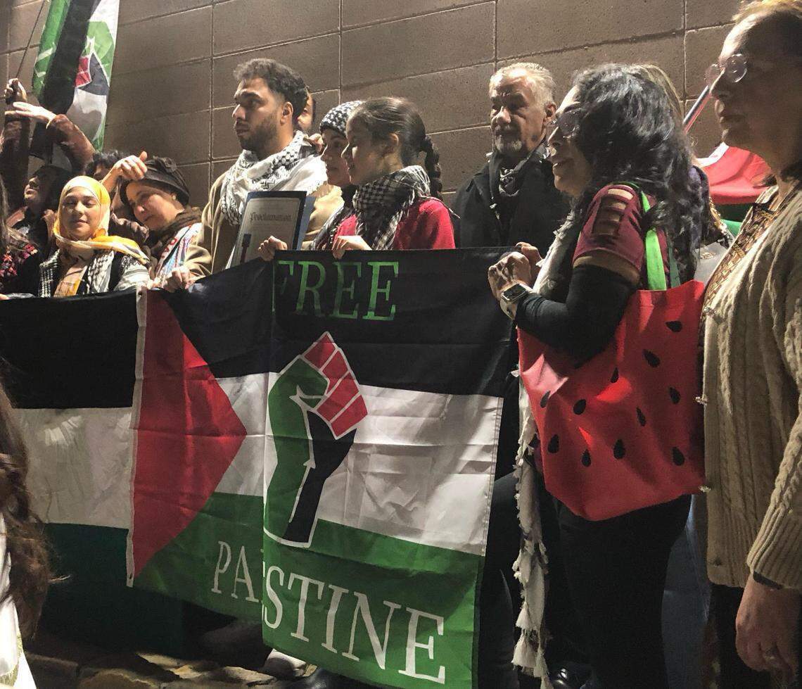 Members of the local Palestinian and Muslim communities pose outside of Madera City Hall on Wednesday, Feb. 14, after the City Council passed a resolution calling for a ceasefire in Gaza. Chants of “viva, viva Palestina” and “free, free, free Palestine” echoed in downtown Madera that night.