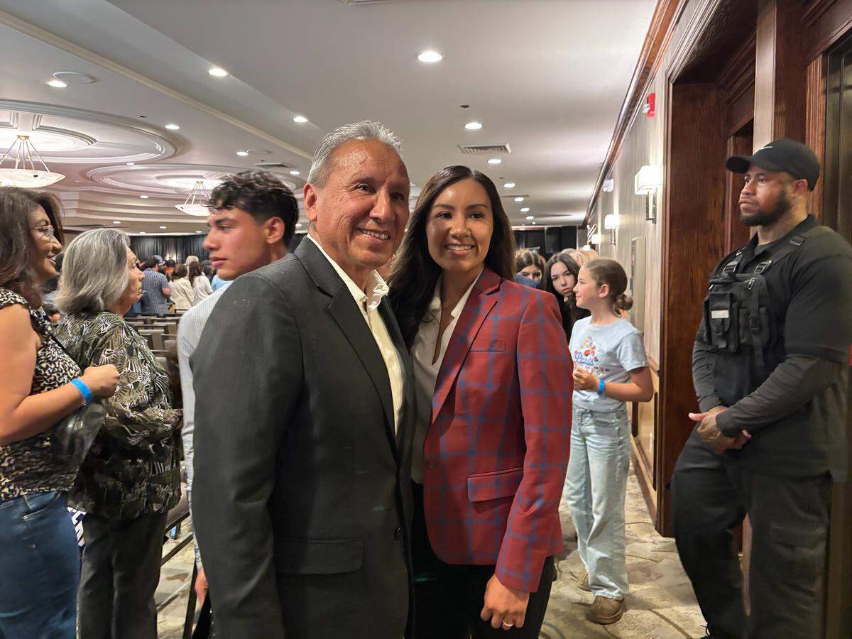 High-Speed Rail Board Member Henry Perea and his daughter, Fresno City Councilmember Annalisa Perea pose for a photo at Xavier Becerra’s gubernatorial campaign rally at the Doubletree Hilton in downtown Fresno on Saturday May 23, 2026.