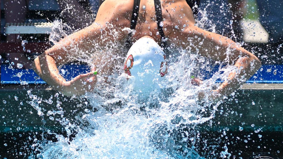 Clovis West’s Hannah Marinovich splashes herself at the starting block as she prepares for the 100 breaststroke at the 2023 CIF swimming and diving state championships on Saturday, May 13, 2023 in Fresno.