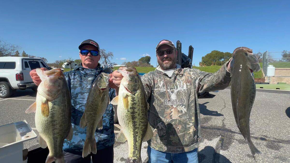 Jeff Eddings and Eladio Garcia show off their winning 19.52-pound stringer (including the 6.08-pound tournament Big Fish) from the Christian Bass League tournament March 25 at Lake Tulloch.