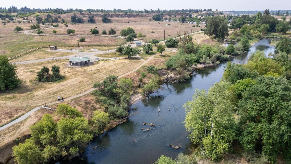 The San Joaquin River curves past the Jensen River Ranch area that is part of the San Joaquin River Conservancy with its trail access points just to the north of Fresno’s Woodward Park in this drone image taken on Wednesday, April 20, 2025.