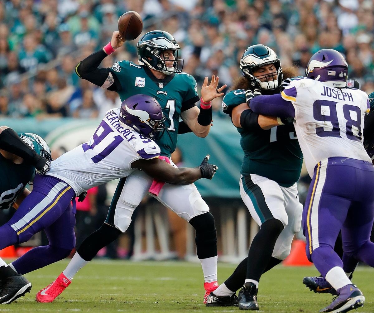 Philadelphia Eagles quarterback Carson Wentz fumbles after being hit by Minnesota Vikings defensive end Stephen Weatherly during a 23-21 loss, Sunday, Oct. 7, 2018 in Philadelphia. The Eagles need to bolster their run game through a trade and the Bills’ LeSean McCoy is a perfect fit, NFL Network analyst David Carr said.
