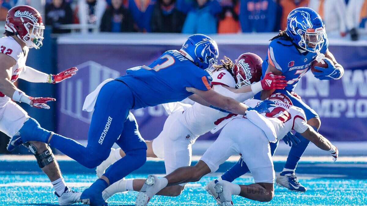 Boise State wide receiver Latrell Caples carries the ball in the first quarter of their Mountain West Championship game against Fresno State held on Saturday, Dec. 3, 2022 at Albertsons Stadium.