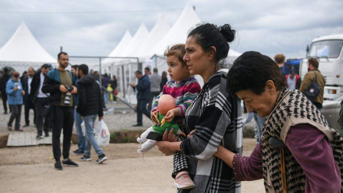 Refugees from Nagorno-Karabakh are seen near a humanitarian aid center in Kornidzor in September 2023.