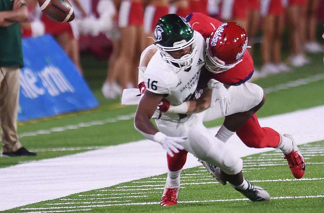 Fresno State’s Justin Rice, right, stops Sacramento State’s Marshel Martin, left, Saturday, Sept 21, 2019 in Fresno.
