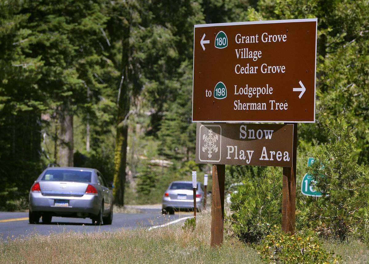 Visitors drive towards the Grant Grove Visitor Center in Kings Canyon National Park in 2020. 