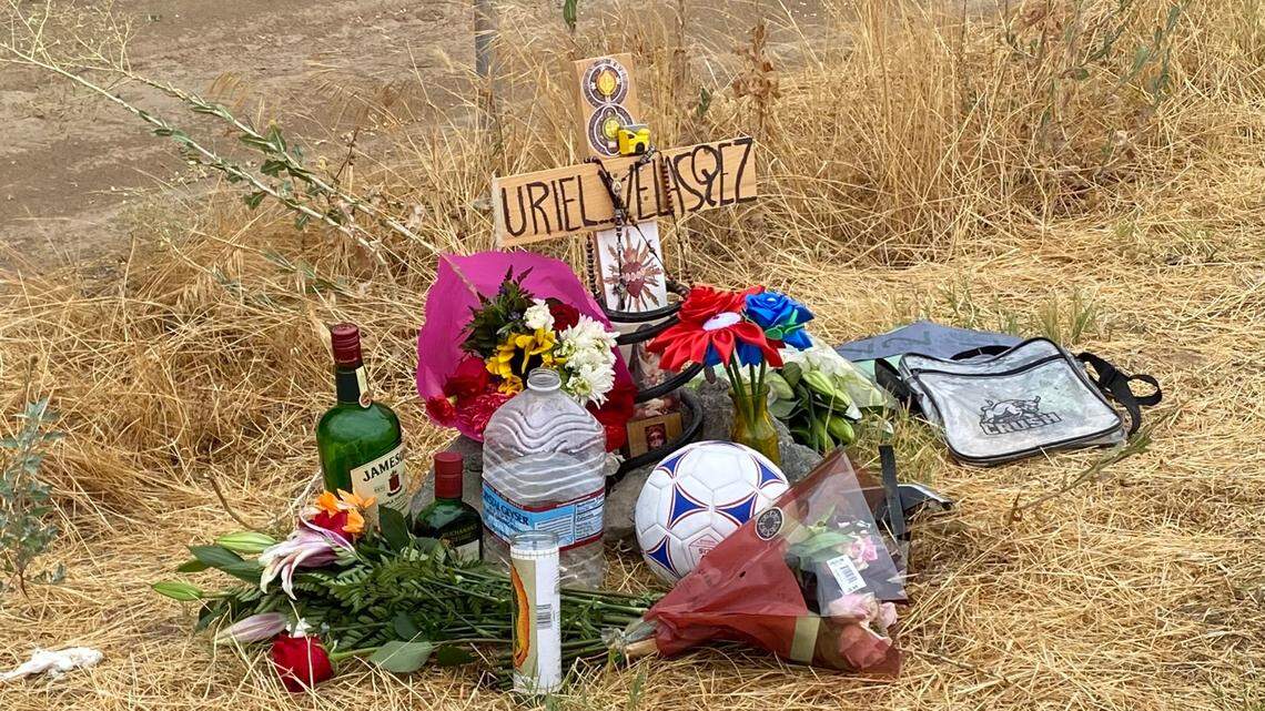 A shrine is placed at Highway 180 and McCall Avenue after former Sanger High soccer player Uriel Velasquez was killed in a collision on Saturday, Aug. 19, 2023.