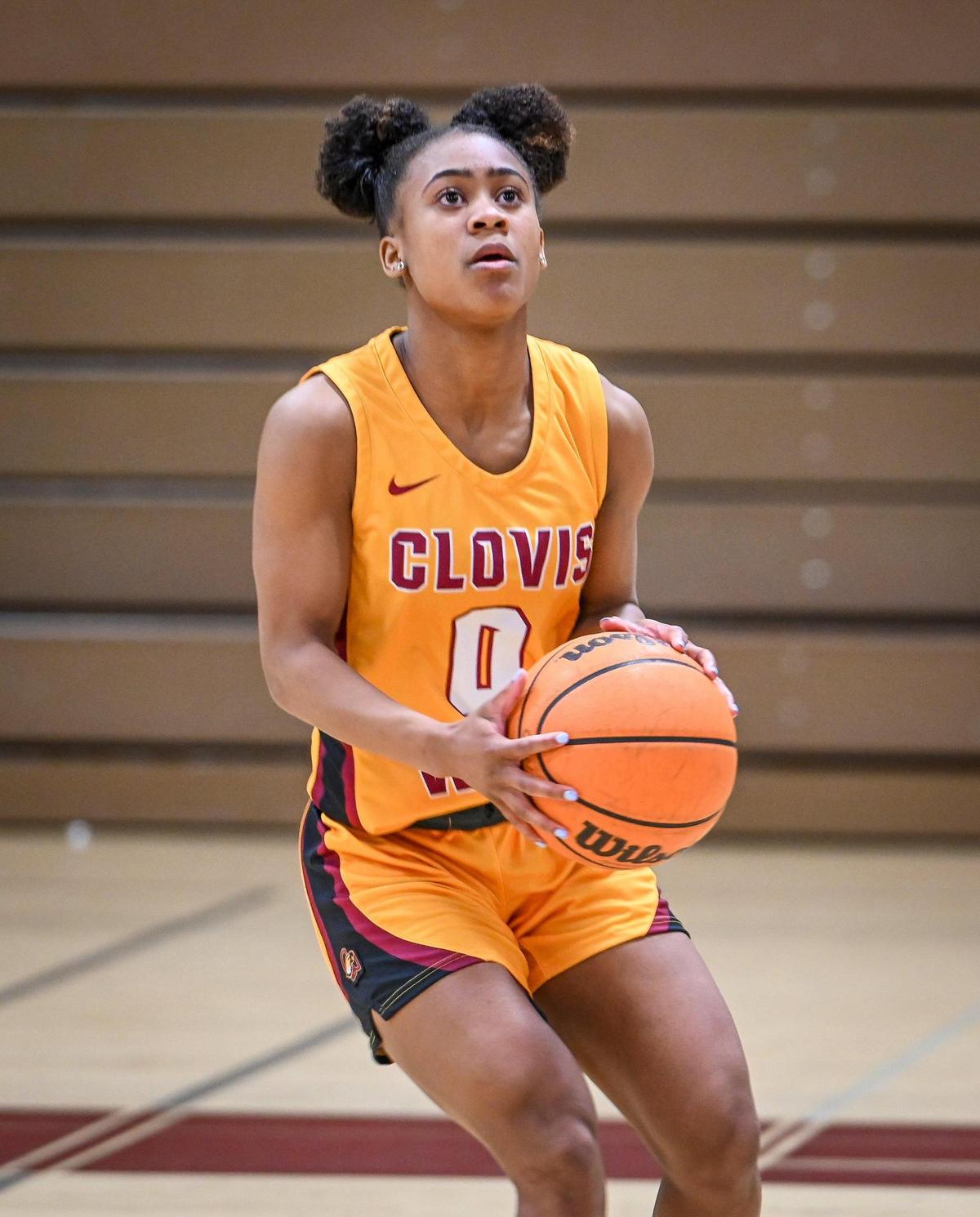 Clovis West girls basketball player Athena Tomlinson, The Fresno Bee’s high school girls basketball Player of the Year, takes a few warm-up shots on Monday, March 27, 2023.