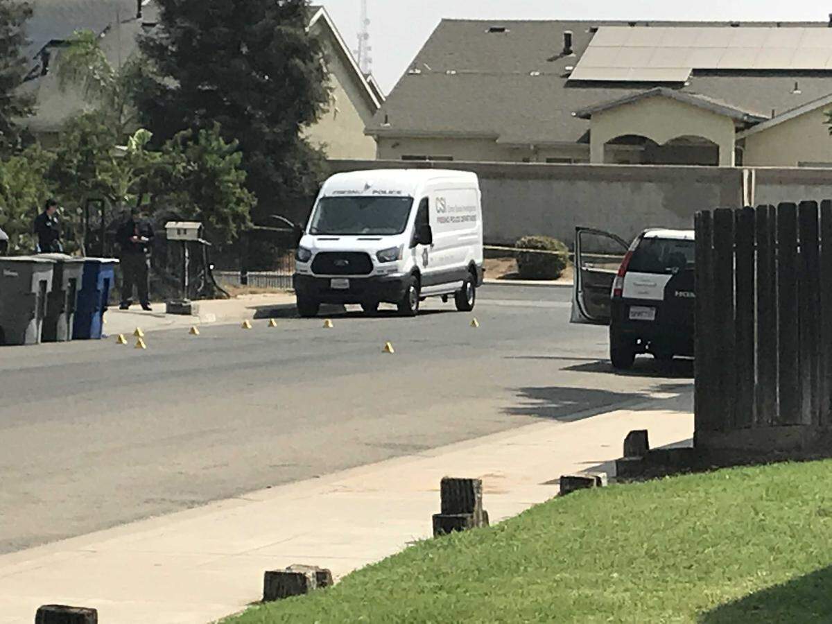 Police crime scene van at the scene of a deadly shooting early Friday morning in the 4200 block of East Fountain Way, west of Highway 99.