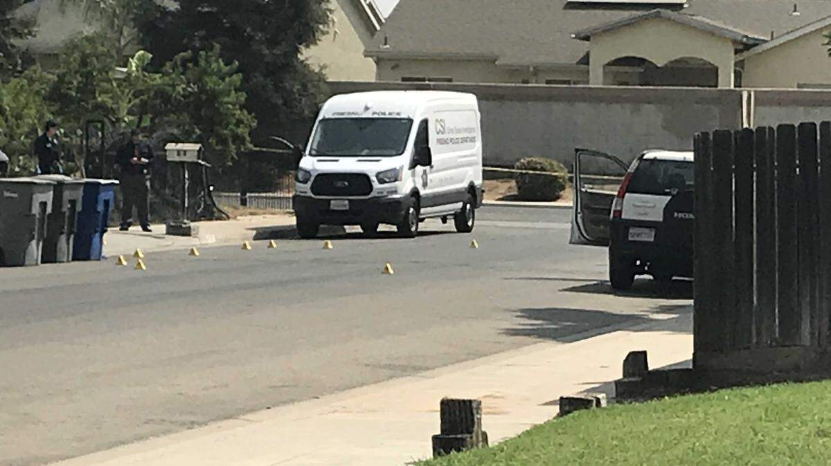 Police crime scene van at the scene of a deadly shooting early Friday, Aug. 24, 2018, in the 4200 block of East Fountain Way, west of Highway 99.